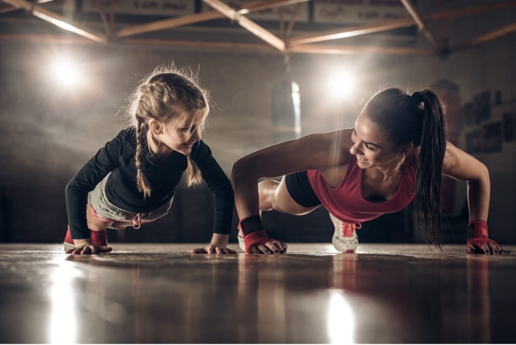 mom and child doing push-ups