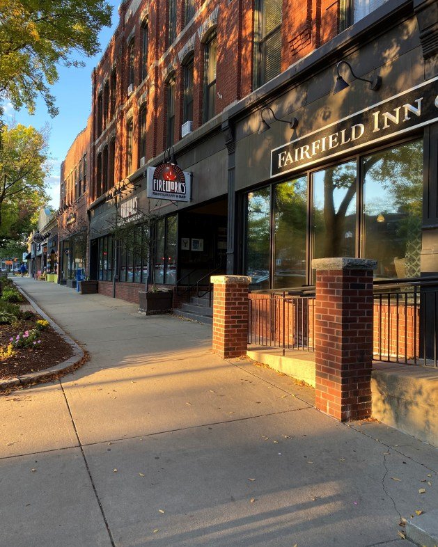 A sidewalk and a building

Description automatically generated