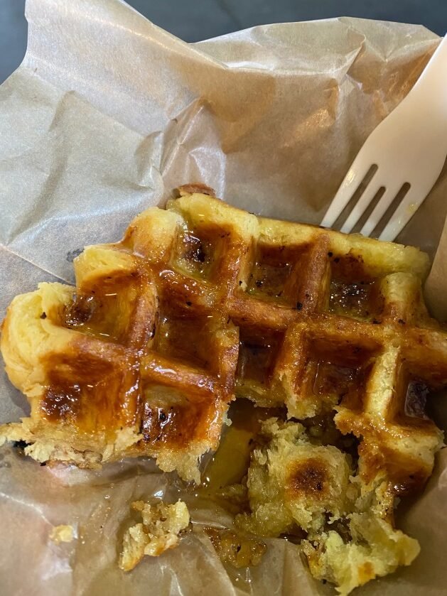 A waffle with a fork

Description automatically generated